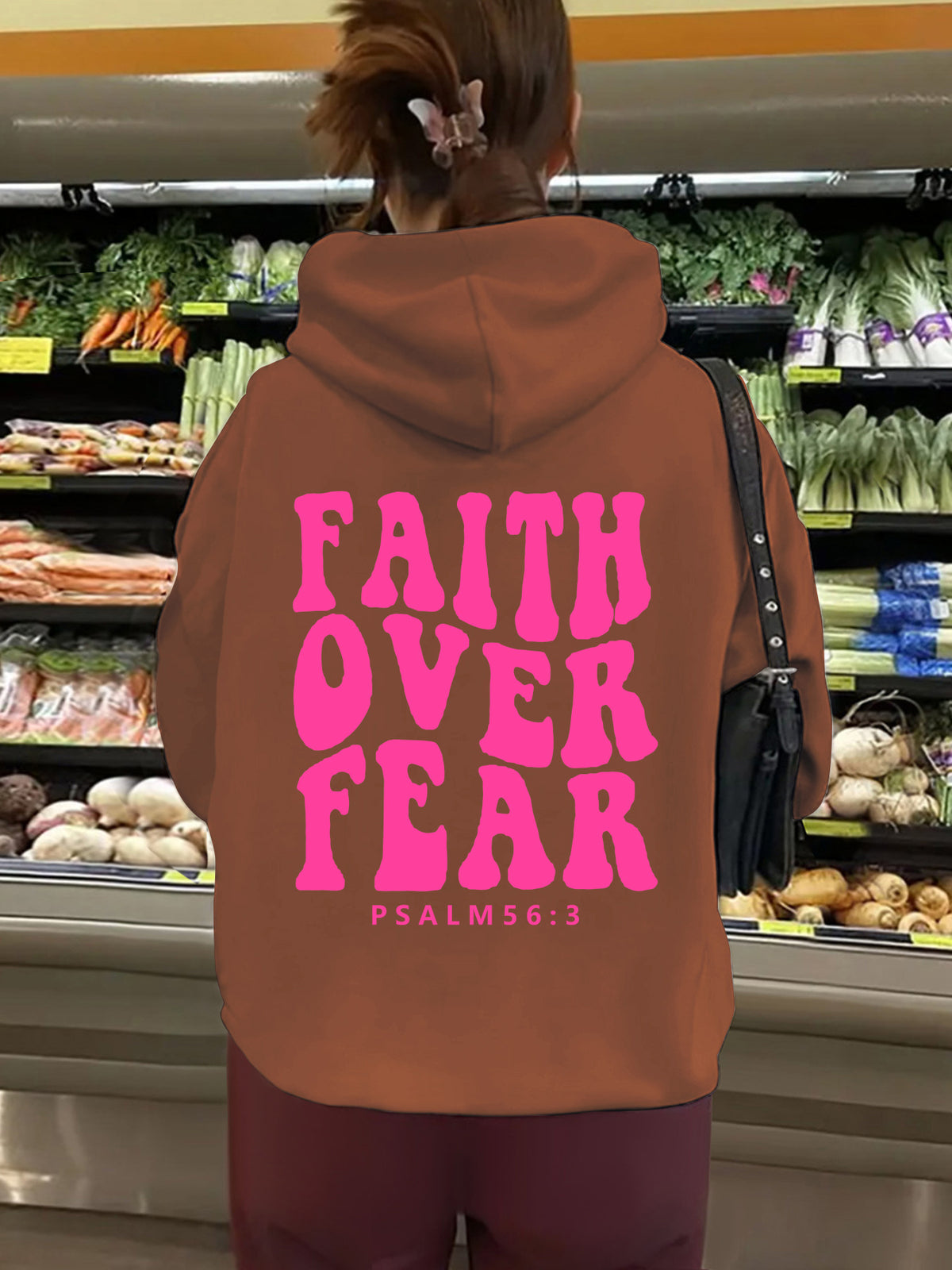 Hooded long sleeved fleece sweatshirt with Faith Over Fear print