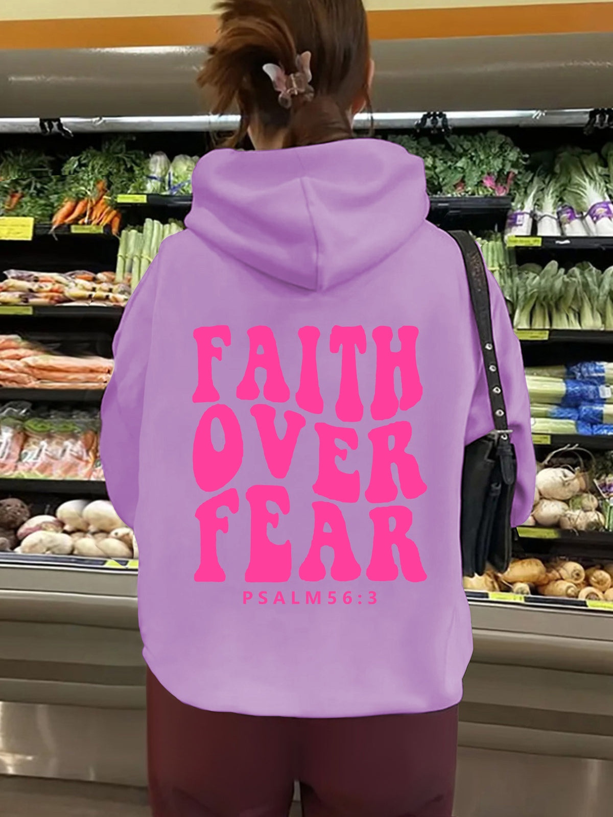 Hooded long sleeved fleece sweatshirt with Faith Over Fear print